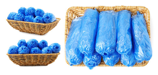 Rolled blue medical shoe covers in baskets isolated on white, set