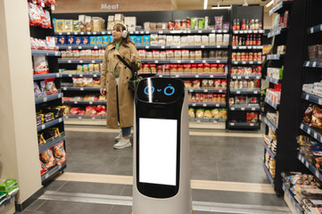 Smart delivery robot near grocery racks with woman in background at supermarket