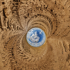 blue hole sphere little planet inside sand or dry grass round frame background