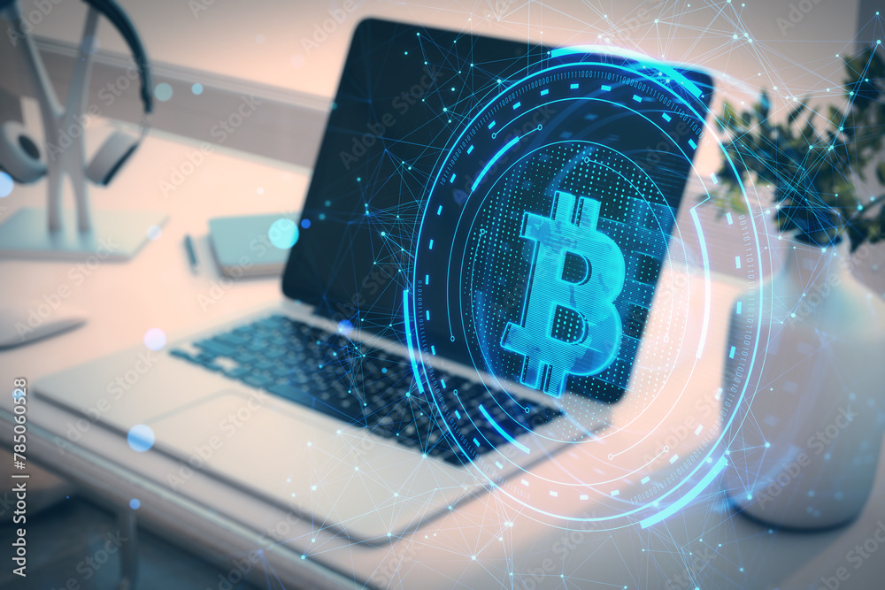 Poster close up of laptop with creative bitcoin hologram on blurry office desk background with vase and hea