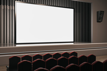 Obraz premium Modern cinema hall with comfortable red seats facing a large blank screen. 3D Rendering