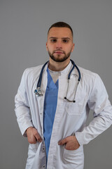 Portrait of caucasian male doctor, general practitioner in white coat isolated