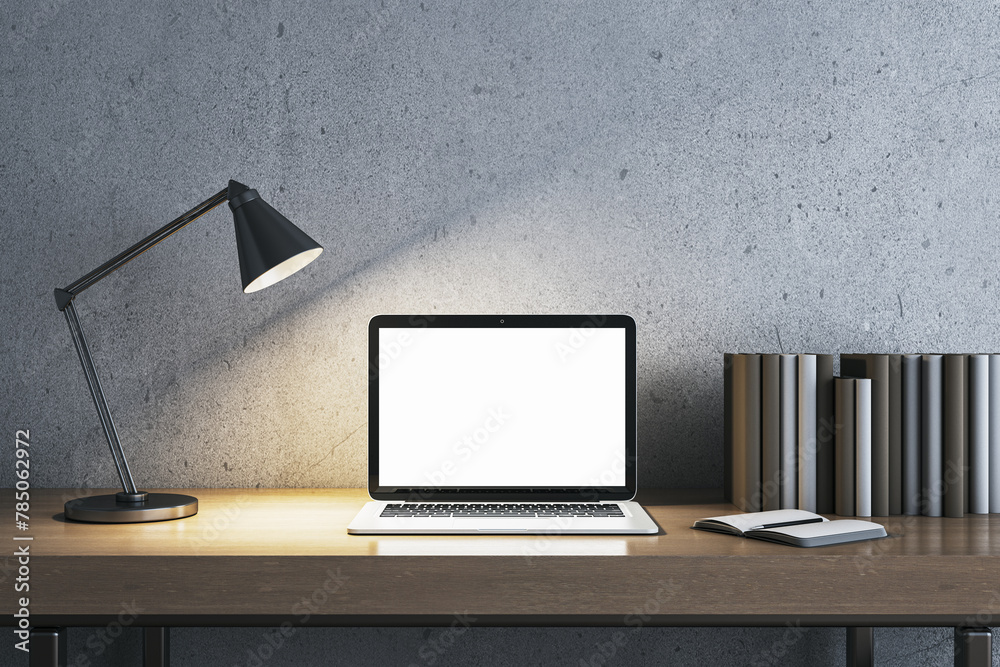 Poster modern concrete workplace with lamp, books and white mock up laptop. workspace close up. 3d renderin
