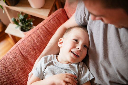 Father and son spending leisure time at home