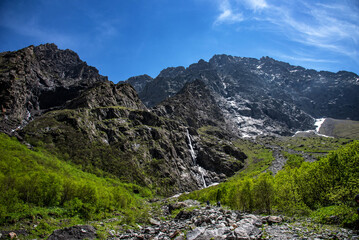 Beautiful panoramic view of Midagrabin waterfalls in summer, North Ossetia, Russia.