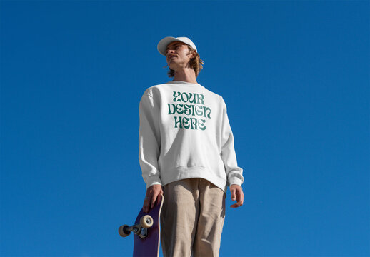 Mockup of skater wearing customizable sweatshirt, blue sky