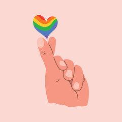 Fingers of human hand, heart symbol, rainbow LGBT flag