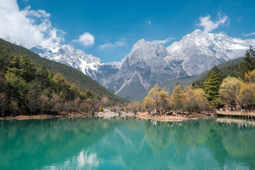 Nature view blue moon valley or Baishuhe River and Jade Dragon Snow Mountain with blue sky background in morning time in Shangri-La or Xiang Ge Le La, Lijiang city at Yunnan, China