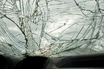 Broken glass texture, car windshield after traffic accident, shattered glass material background