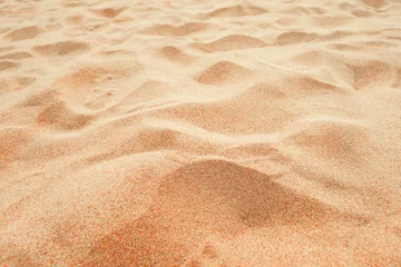 Deurstickers Beach sand background, close up, Low angle view of brown sandy surface in tropical resort. Vacation and summer holiday concept. © Bits and Splits