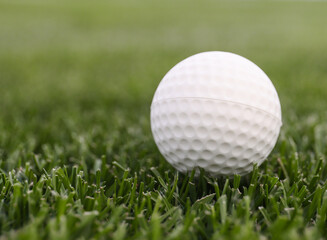 Game ball for playing golf on green grass
