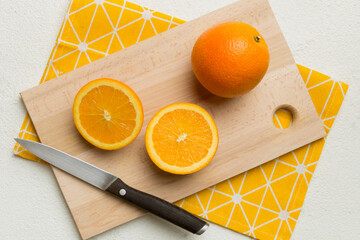 Fresh ripe oranges on cutting board on table. Top view Flat lay