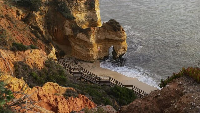 Praia do Camilo beach by the Atlantic Ocean on Algarve coast in southern Portugal.