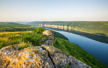 The view from the top of the great Dniester river that flows through the hilly area. Ukraine. - 785090987