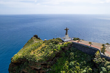 Jesus Christ Statue of Christ the King in Garajau (Cristo Rei ) near Funchal. Aerial drone view - 785094158