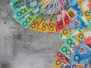 Different denomination Australian dollars AUD currency on desk - obrazy, fototapety, plakaty