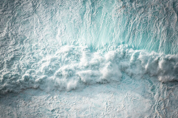 Ocean waves crashing, abstract pattern, top down aerial drone view.