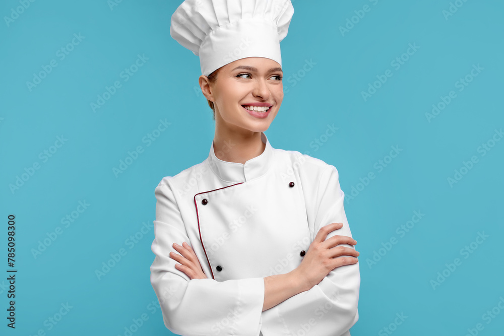 Poster Happy chef in uniform on light blue background