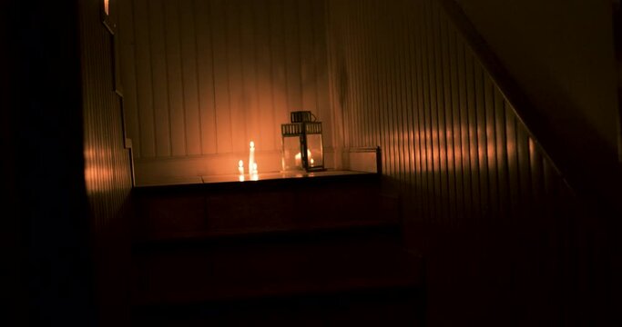 Investigation in Haunted House Lit with Candles