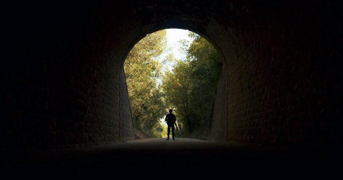 Light at the End of the Tunnel with an Armed Guard
