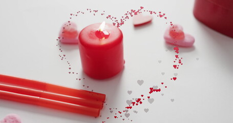 Image of hearts over candles on white background