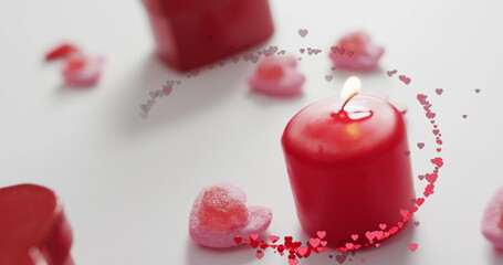 Image of multiple red hearts over red candles - obrazy, fototapety, plakaty