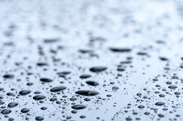 Raindrops on the windshield of a car 1