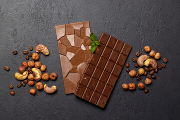 Two chocolate bars on stone background