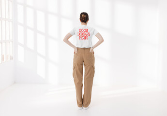 Mockup of woman in studio wearing customized t-shirt