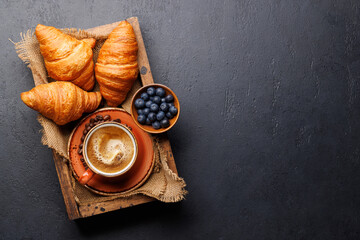 Cappuccino coffee and fresh croissants