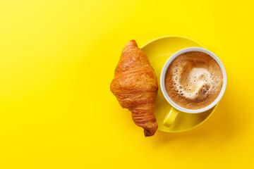 Cappuccino coffee and fresh croissant