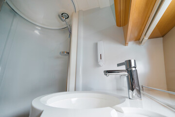 Luxury traveling. Bathroom interior of modern motor yacht.