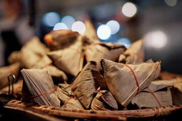 Sticky rice covered by banana leaves. Street food in Thailand.