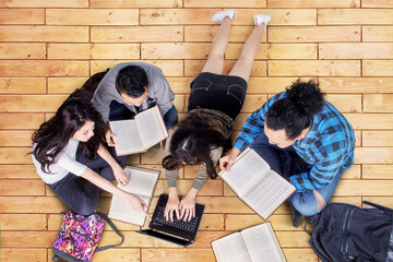 Top down view of college students studying together