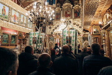 Obraz premium People go to church to bless Easter cake. Traditional church holiday of Easter