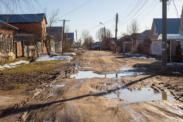 Maloyaroslavets, Russia - April 2018: Uspenskaya Street in the town of Maloyaroslavets, a bad road...