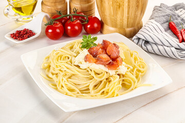 Pasta spaghetti with salmon and stracciatella