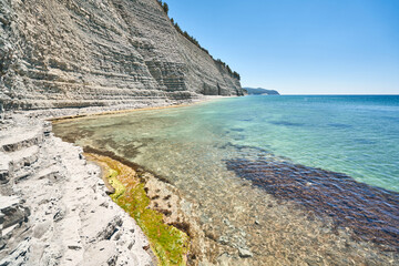 White rocks and clear blue water. Empty beach in Gelendzhik, Russia