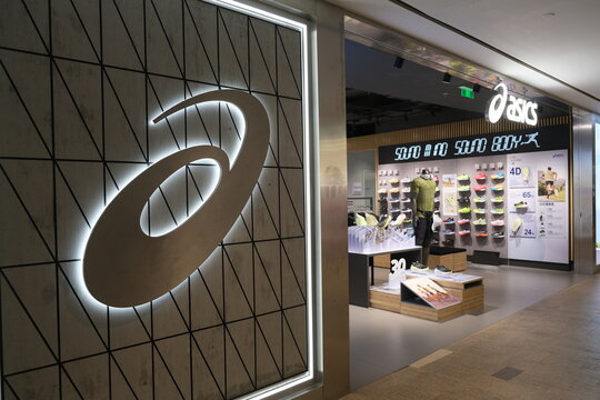 Shanghai,China-August 13th 2023: ASICS Corporation retail store and brand logo sign