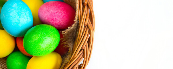 Colored decorated Easter eggs in basket