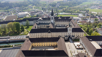 Kremsmünster, Upper Austria, Austria - 04.13.2024: monastery of Kremsmünster in Upper Austria, aerial photography - obrazy, fototapety, plakaty