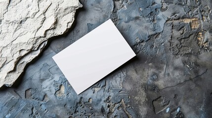 Blank business card with backdrop of boulders. Business Stationery & Branding Mock up. Desk of a creative designer. Flat lay. Copy space for text. 
