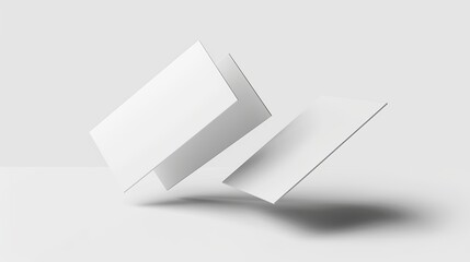 This mockup is a real photo, not a 3D render, of two surreal white business cards floating in midair and isolated on a white background.