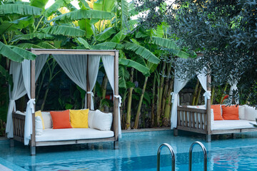 Relaxation Area Inside the Pool Surrounded by Tropical Trees Photo, Alacati Cesme, Izmir Turkiye (Turkey)