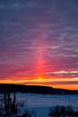 Visual atmospheric phenomenon Light pillar. Protva river, Russia