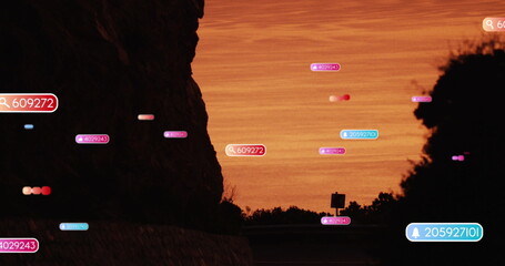 Fototapeta premium Image of social media icons over sunset landscape
