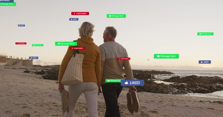 Image of social media text and icons over caucasian couple on beach