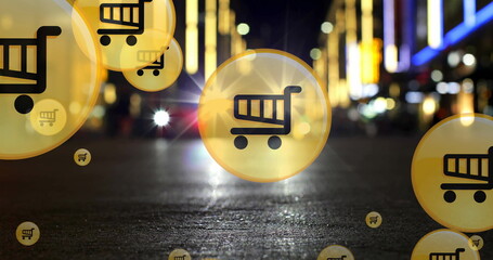 Image of shopping cart icons over low angle view of car moving on street in city