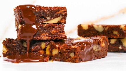 Chocolate brownies with nuts isolated on white background