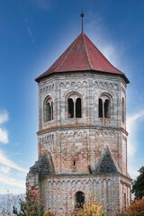 Fototapeta premium Bell-tower of a former monastery in Gollingen Village against blue sky in Kyffhauserland, Germany